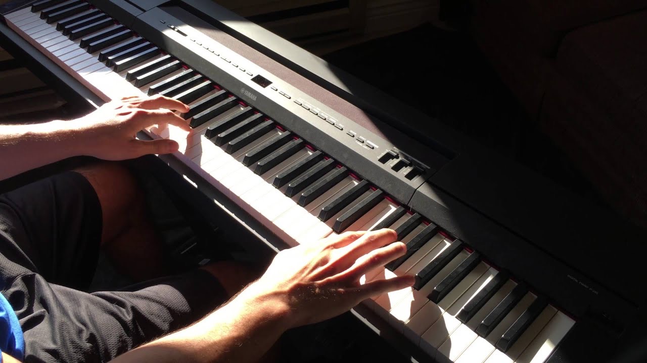 Austin's hands at the piano playing Could It Be